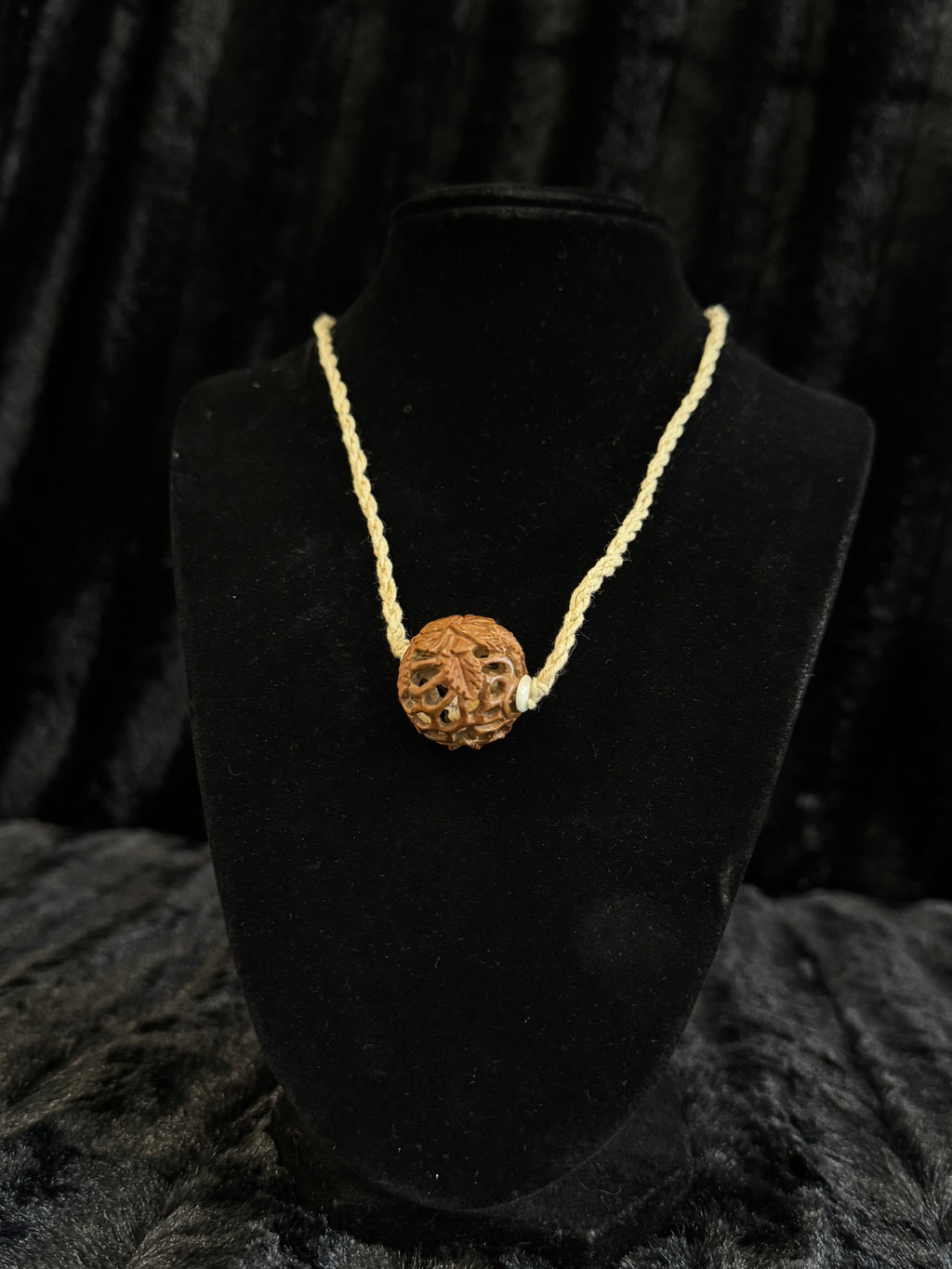 Unique nut carved pendant and cord necklace