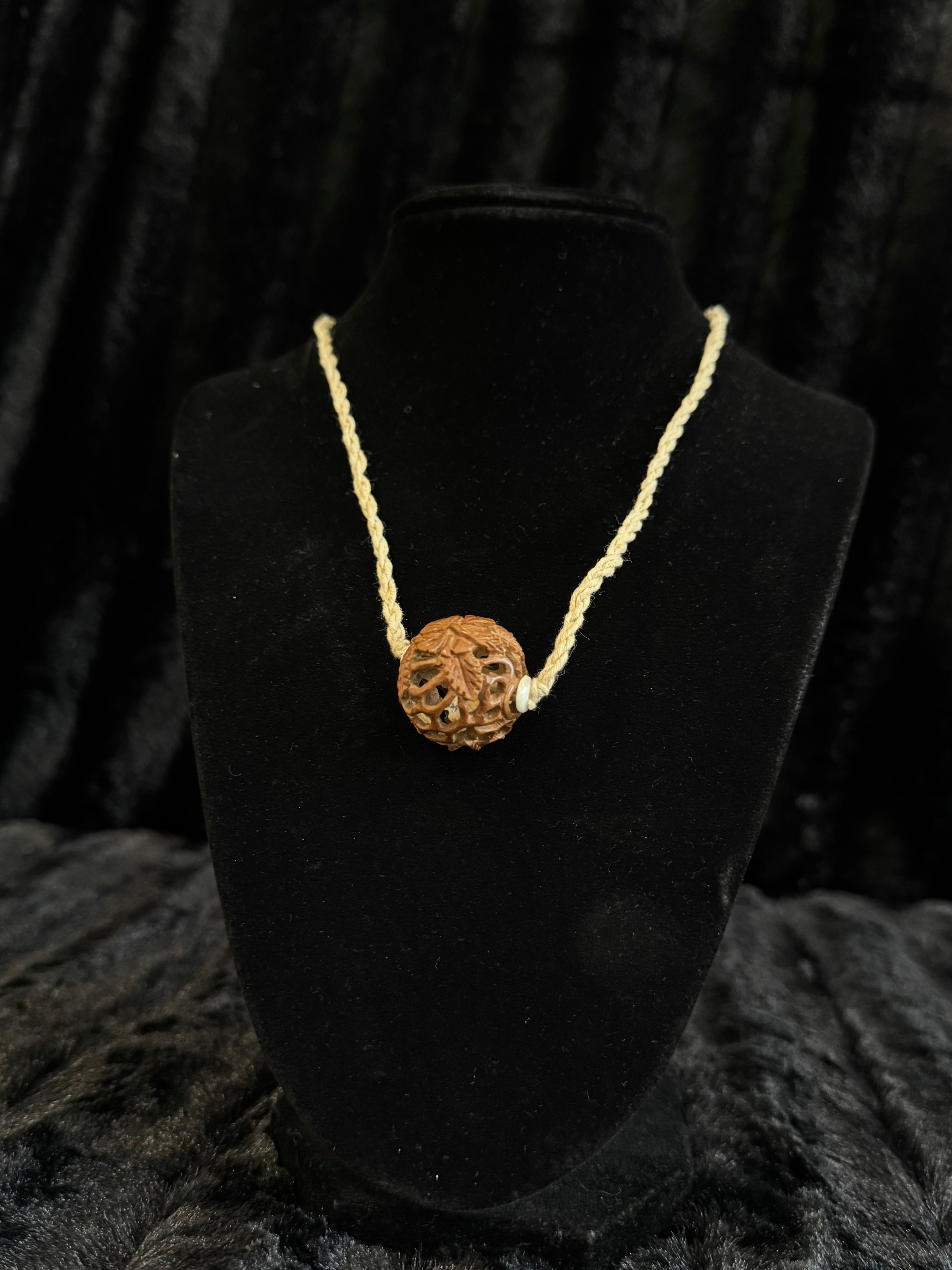 Unique nut carved pendant and cord necklace