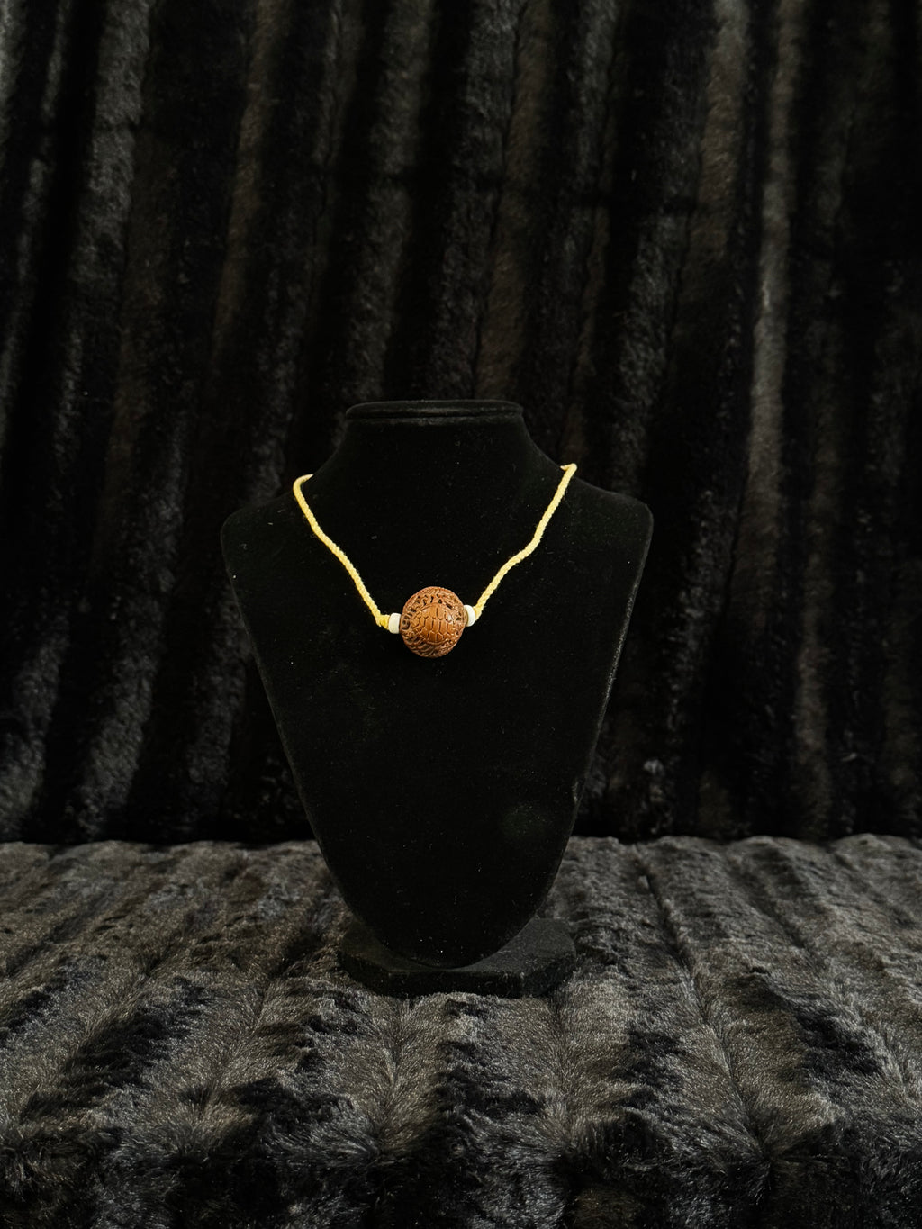 Unique nut carved pendant and cord necklace