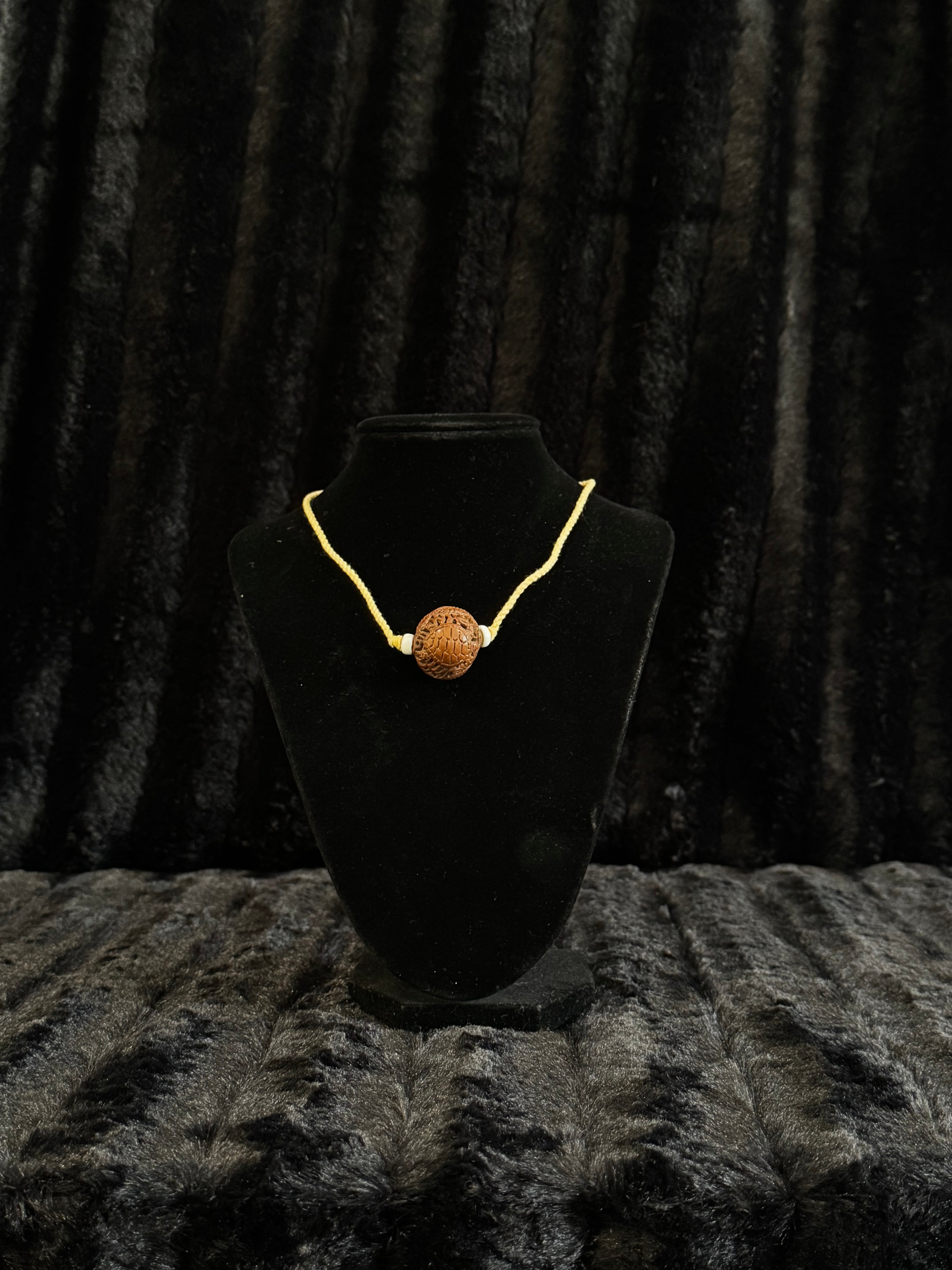 Unique nut carved pendant and cord necklace