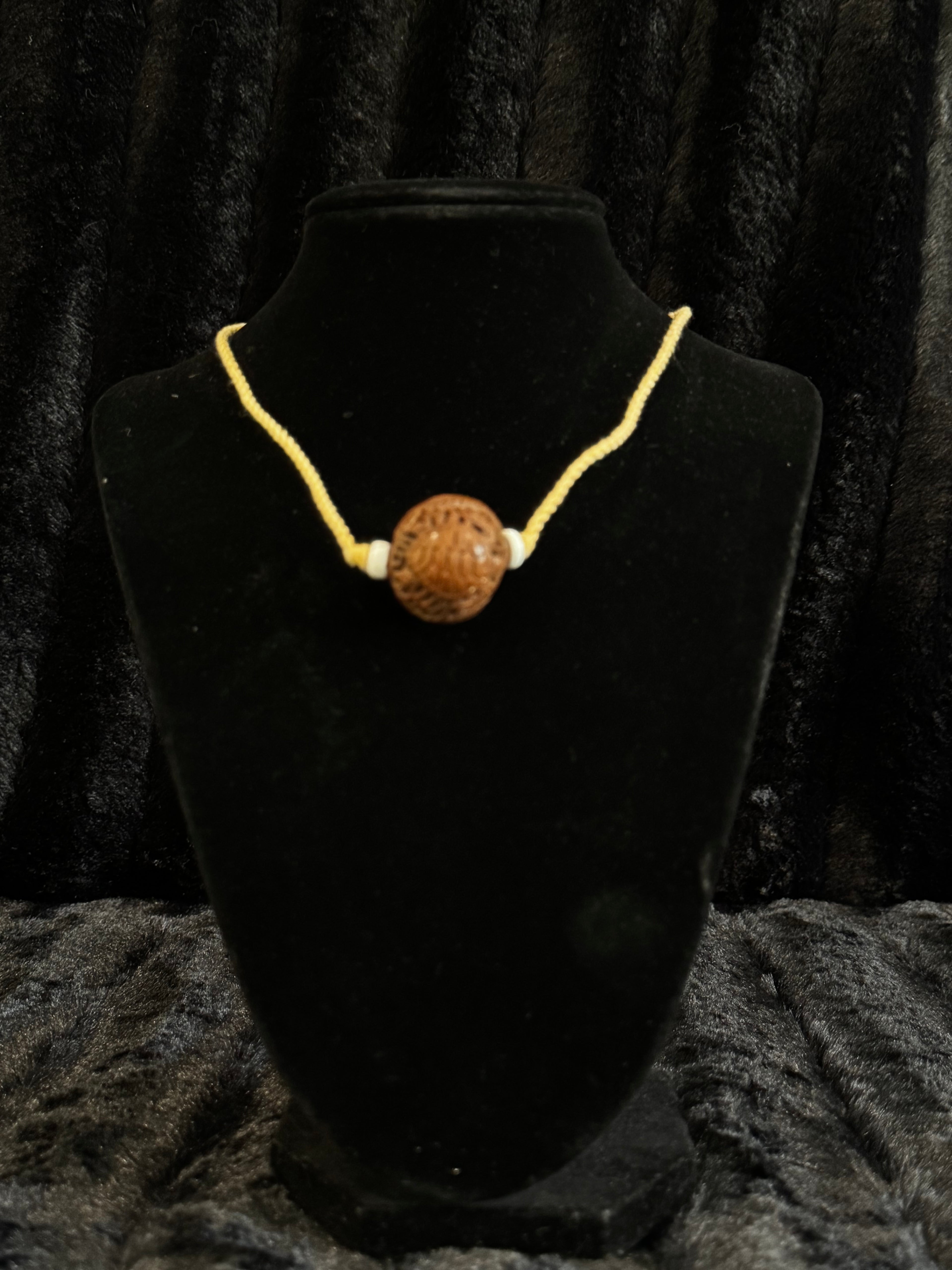 Unique nut carved pendant and cord necklace